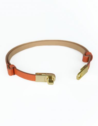 Pomarańczowy skórzany pasek damski...