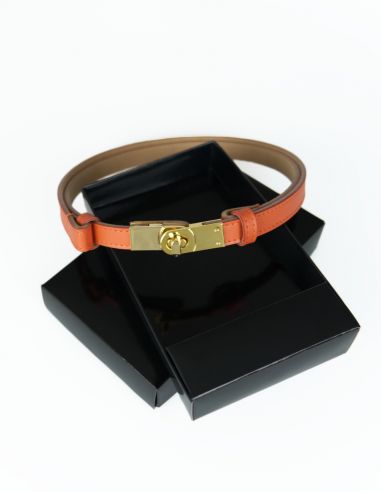 Pomarańczowy skórzany pasek damski...